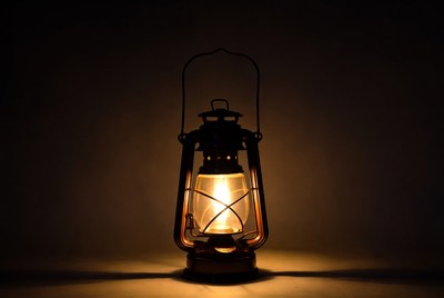 Vintage Lantern Glowing on Dark Background