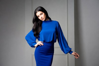 Woman in blue turtleneck dress