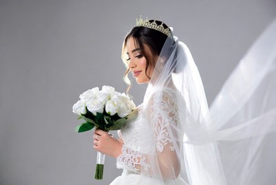 Bride holding white roses bouquet