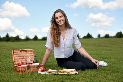 Woman enjoying picnic on grass