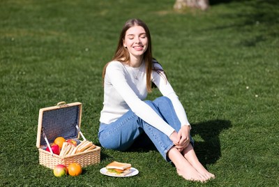 Woman enjoying picnic in grass