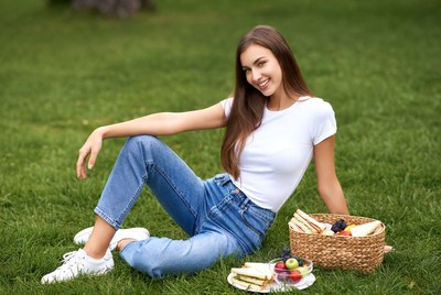 Woman with picnic basket on grass