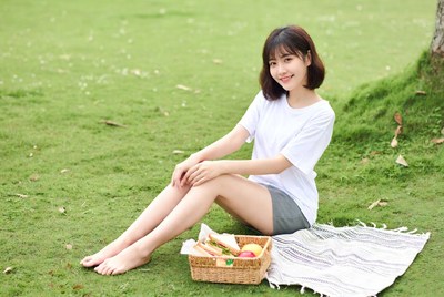 Asian woman picnic on grass
