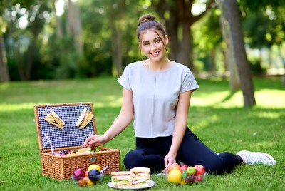 Woman enjoying picnic in park