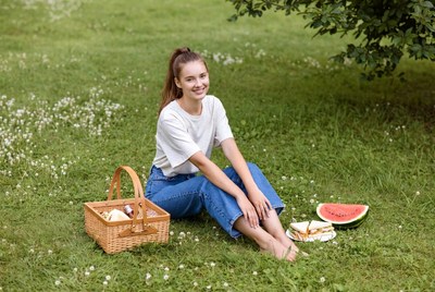 Woman with watermelon picnic basket