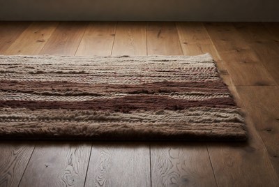 Woven Brown Rug on Wooden Floor
