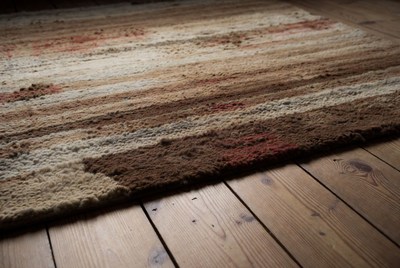 Striped Wool Rug on Wooden Floor