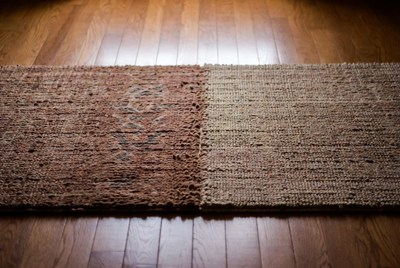 Two Woven Rugs on Wooden Floor