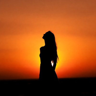 Woman silhouette at sunset