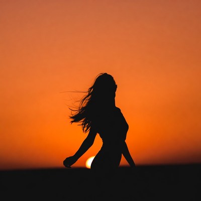Woman silhouette at sunset