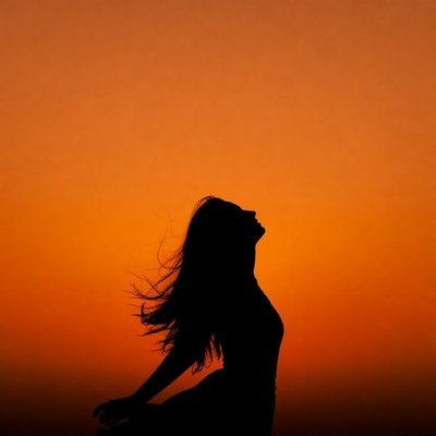 Woman silhouette at sunset
