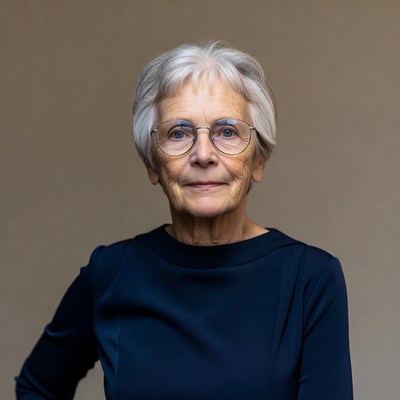 Elderly woman with glasses smiling