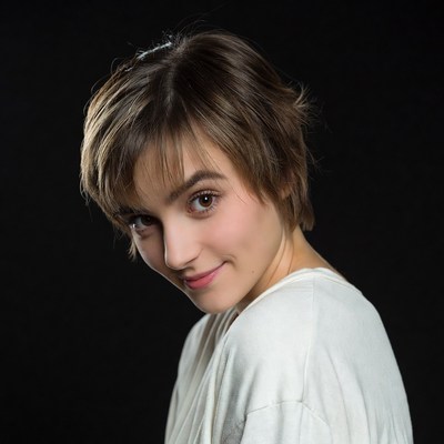 Young woman smiling over shoulder