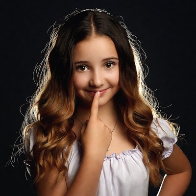 Girl shushing with finger on lips