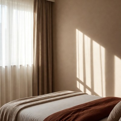 Bedroom with sheer curtains and bed