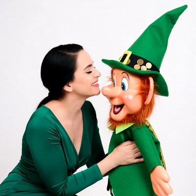 Woman kissing leprechaun puppet