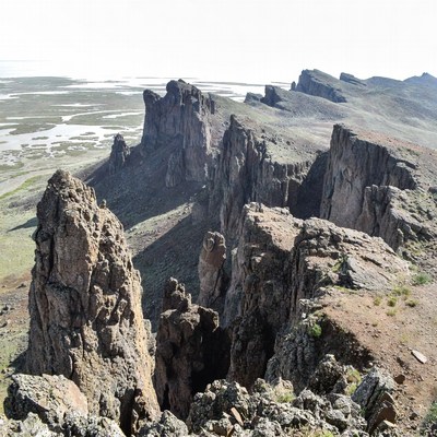Jagged Rock Formations Over Salt Flat