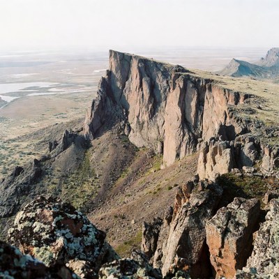 Dramatic Cliff Overlooking Vast Desert Valley