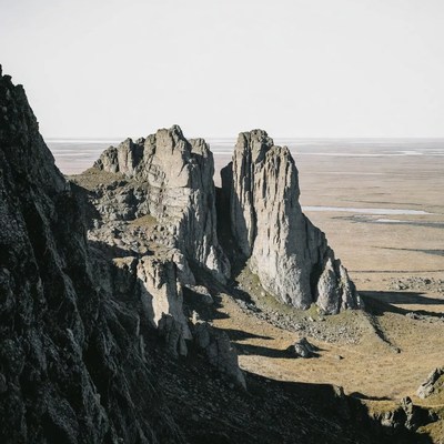 Towering Rock Formations in Vast Tundra