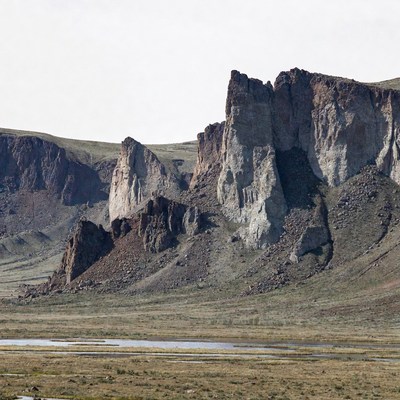 Towering Rock Formations in Grassland