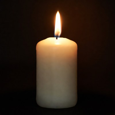 Burning Candle on Black Background