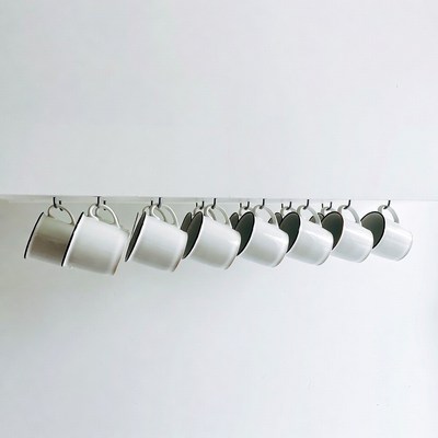 White Mugs Hanging on Rack
