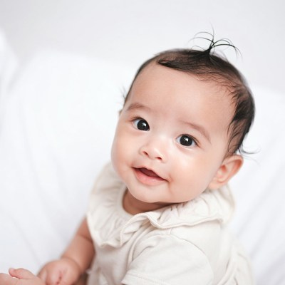 Asian baby smiling on white background