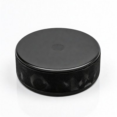 Black hockey puck isolated