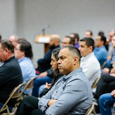 Diverse men at conference audience