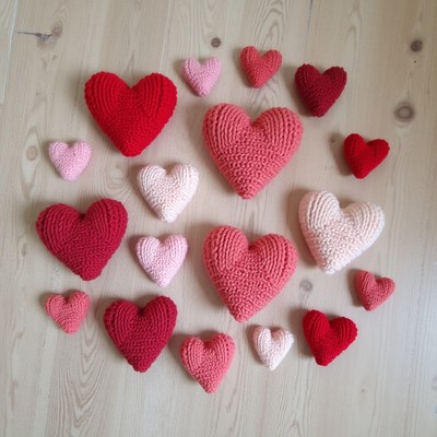 Crocheted Hearts on Wooden Floor