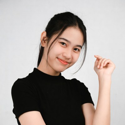 Asian girl smiling with hand gesture