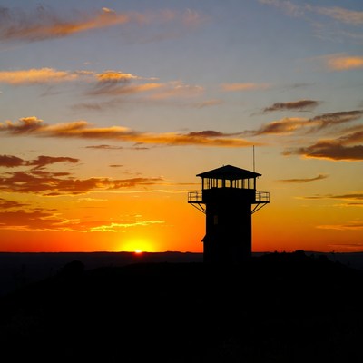 Silhouette lighthouse at sunset