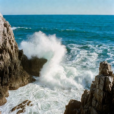 Ocean Waves Crashing on Rocky Cliff