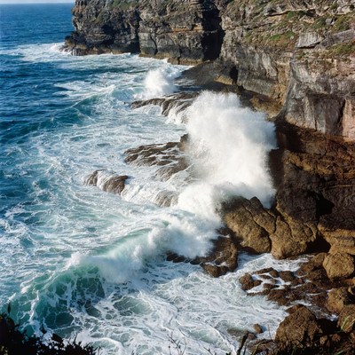 Ocean Waves Crashing on Cliff Rocks