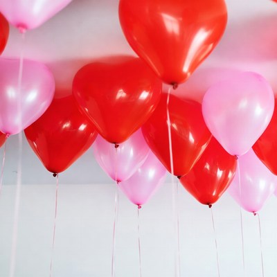 Cluster of red and pink heart balloons