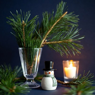 Snowman with Pine Branches and Candle