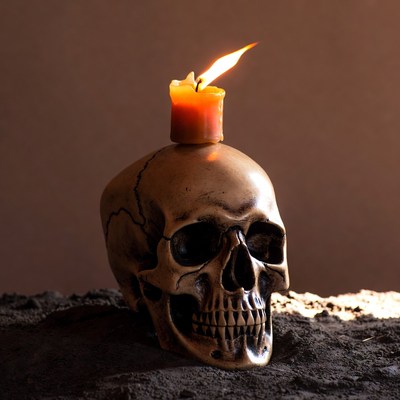Candle Burning on Human Skull