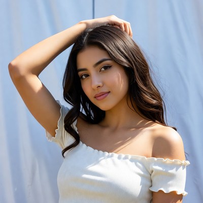 Young woman hand on head smiling