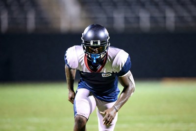 African-American football player in stance