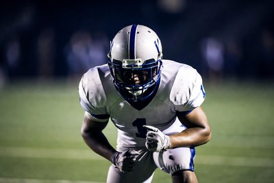 African-American football player in stance