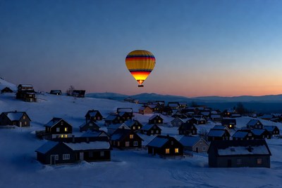 Hot Air Balloon Over Snowy Mountain Village