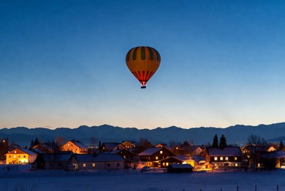 Hot Air Balloon Over Snowy Village