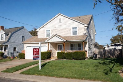 White House for Sale with Sign