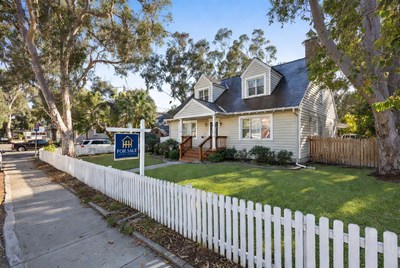 For Sale House with Blue Sign
