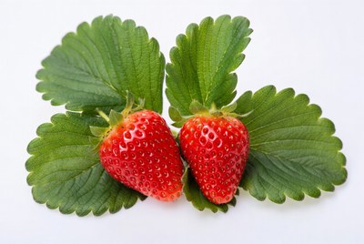 Two Strawberries with Green Leaves