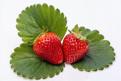 Two Strawberries with Green Leaves