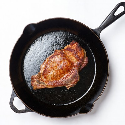 Cooked Pork Chop in Cast Iron Skillet