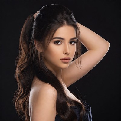 Woman with ponytail on black background