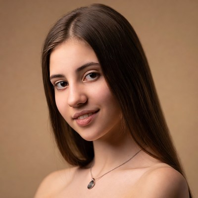 Young woman with long brown hair smiling