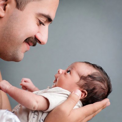 Father holding newborn baby